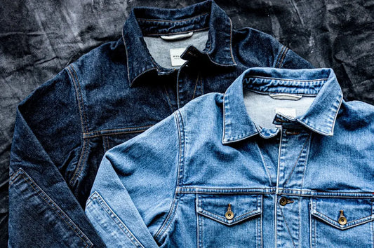 Small-batch clothing denim jackets in dark and light washes, highlighting craftsmanship and classic design