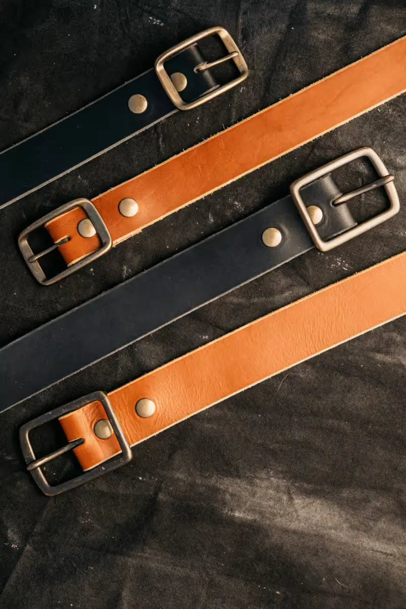 High-quality Black and Brown 8oz American Latigo leather belts in 1.7” width with brass buckles and rivet details