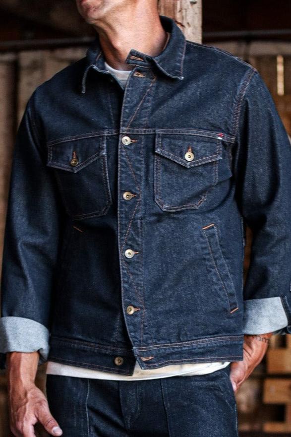 USA made denim jacket with rolled cuffs, featuring sturdy construction and utility-style chest pockets.