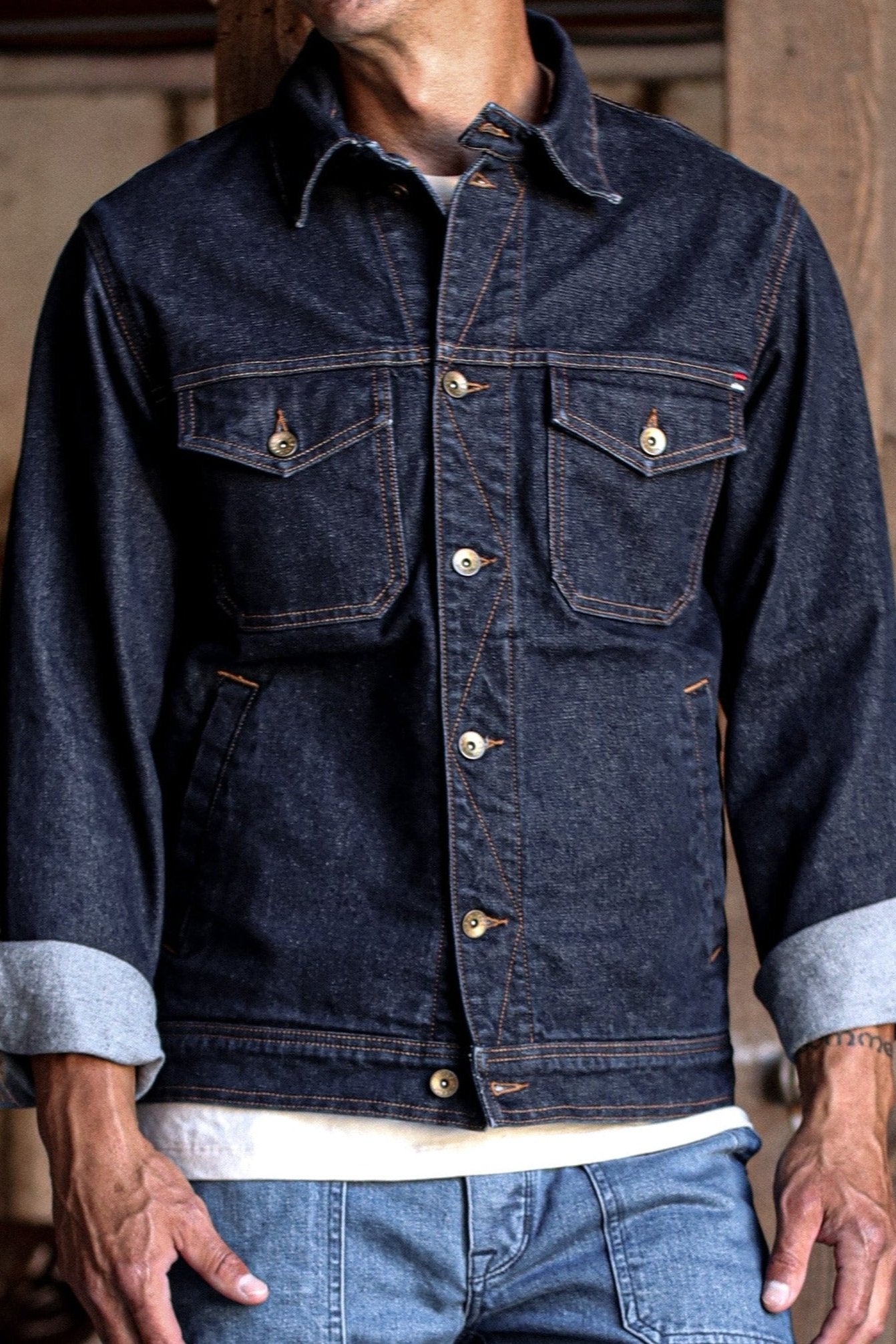 USA made canvas jacket in deep indigo denim with contrast stitching and classic button-front details.
