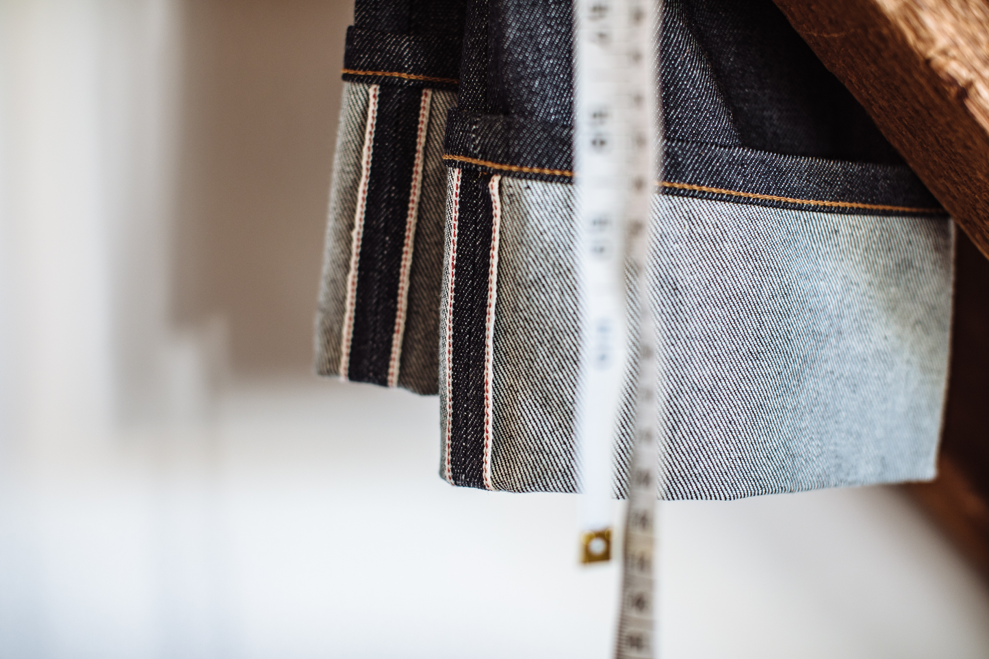 close up of cuffed denim jeans