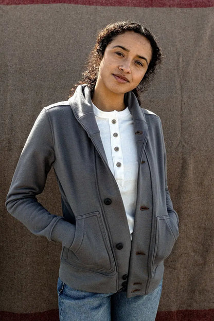 woman smiling with gray shawl